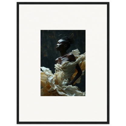 Portrait of a person with dark skin wrapped in flowing white fabric against a dark background.