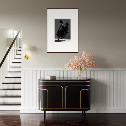 Elegant black sideboard with gold trim enhancing room decor and canvas prints