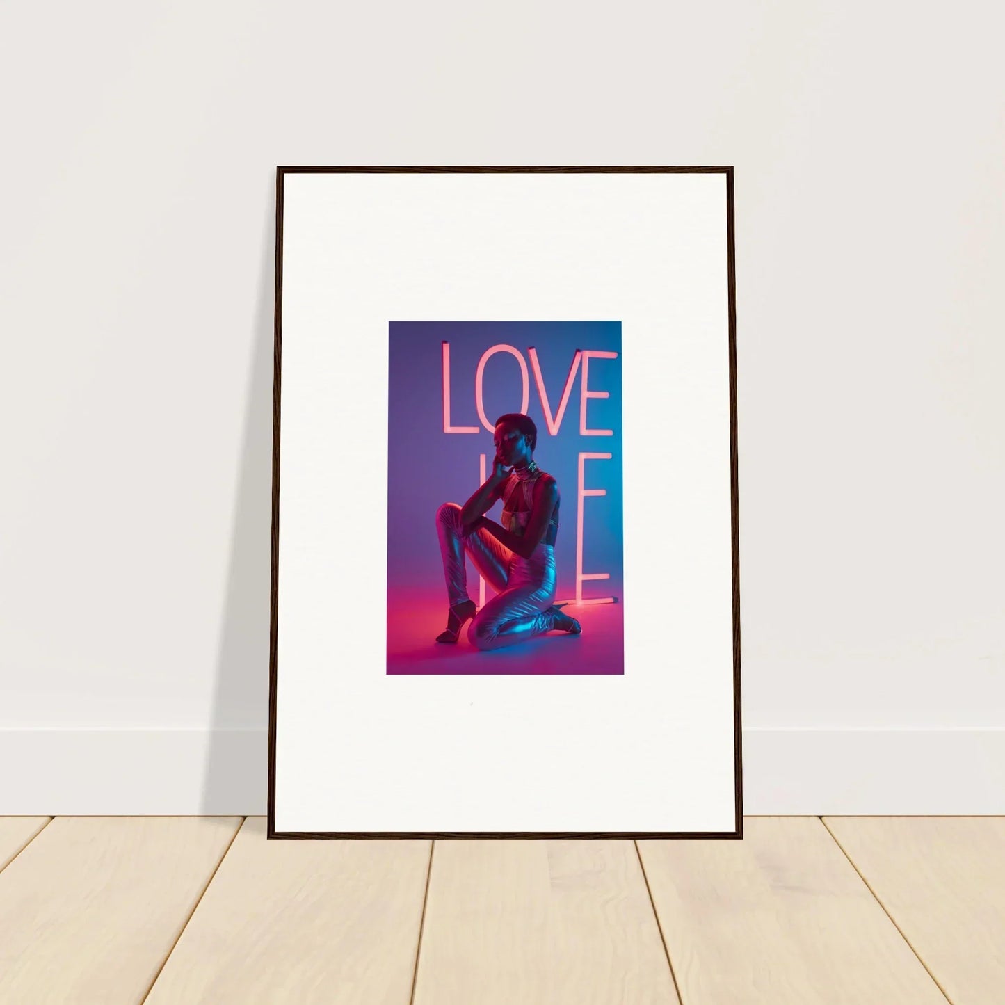 Framed canvas print of neon rapture with LOVE text and seated figure for cool room decoration