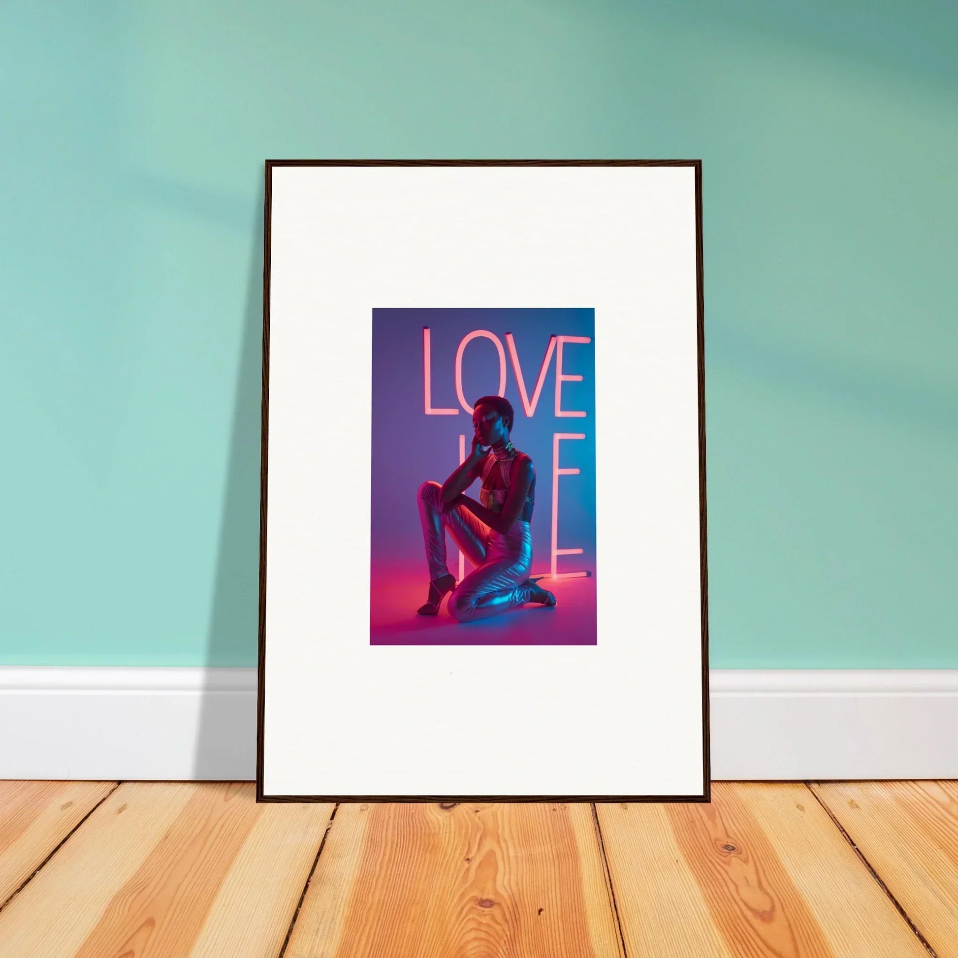 Framed canvas print of a neon Rapture LOVE sign with a cool silhouetted figure