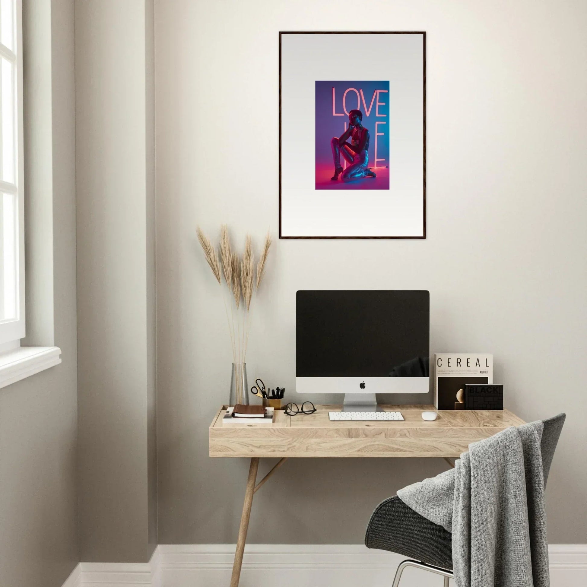 Framed canvas print of ’LOVE’ with a silhouette in neon rapture colors for room decoration