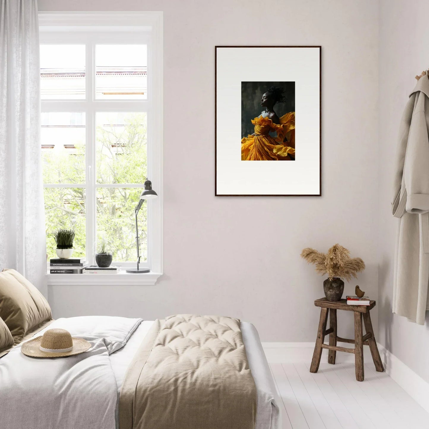 Bright, airy bedroom with white decor and framed wall art, embodying sunlit whispers