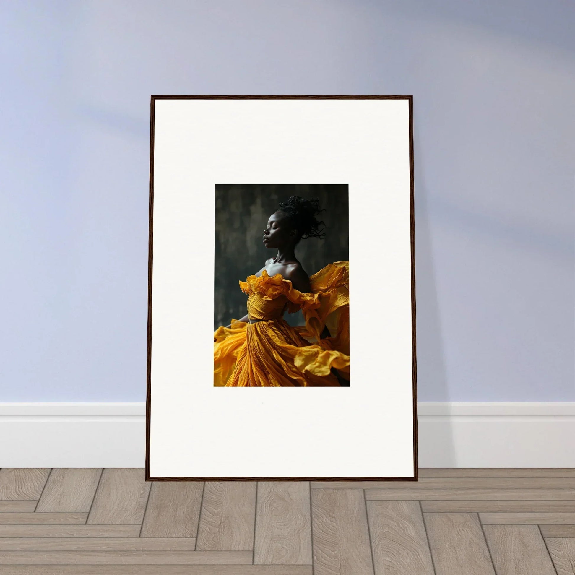 Framed wall art of a figure in a yellow-orange dress, ideal for sunlit whispers room decor