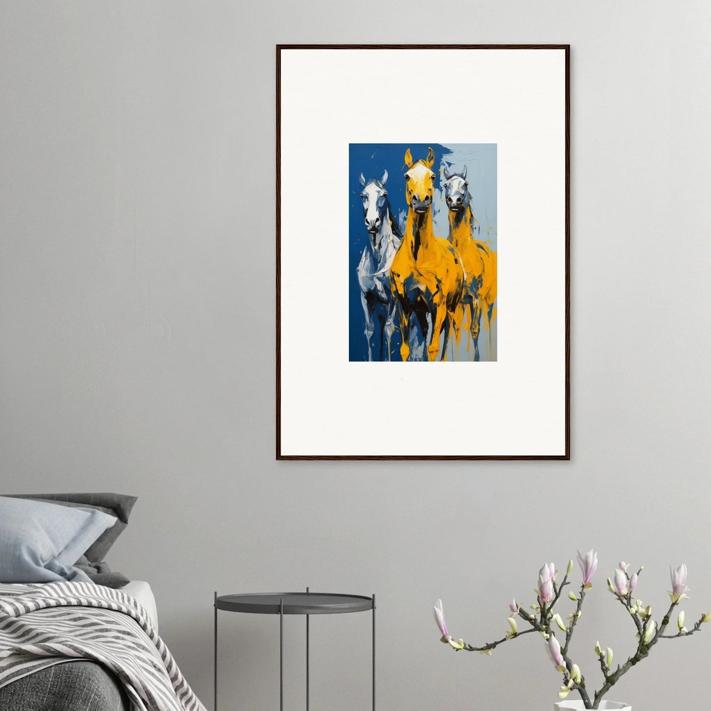 Framed abstract painting in yellow and blue shapes resembling horses, Eleven Sunrise room decor