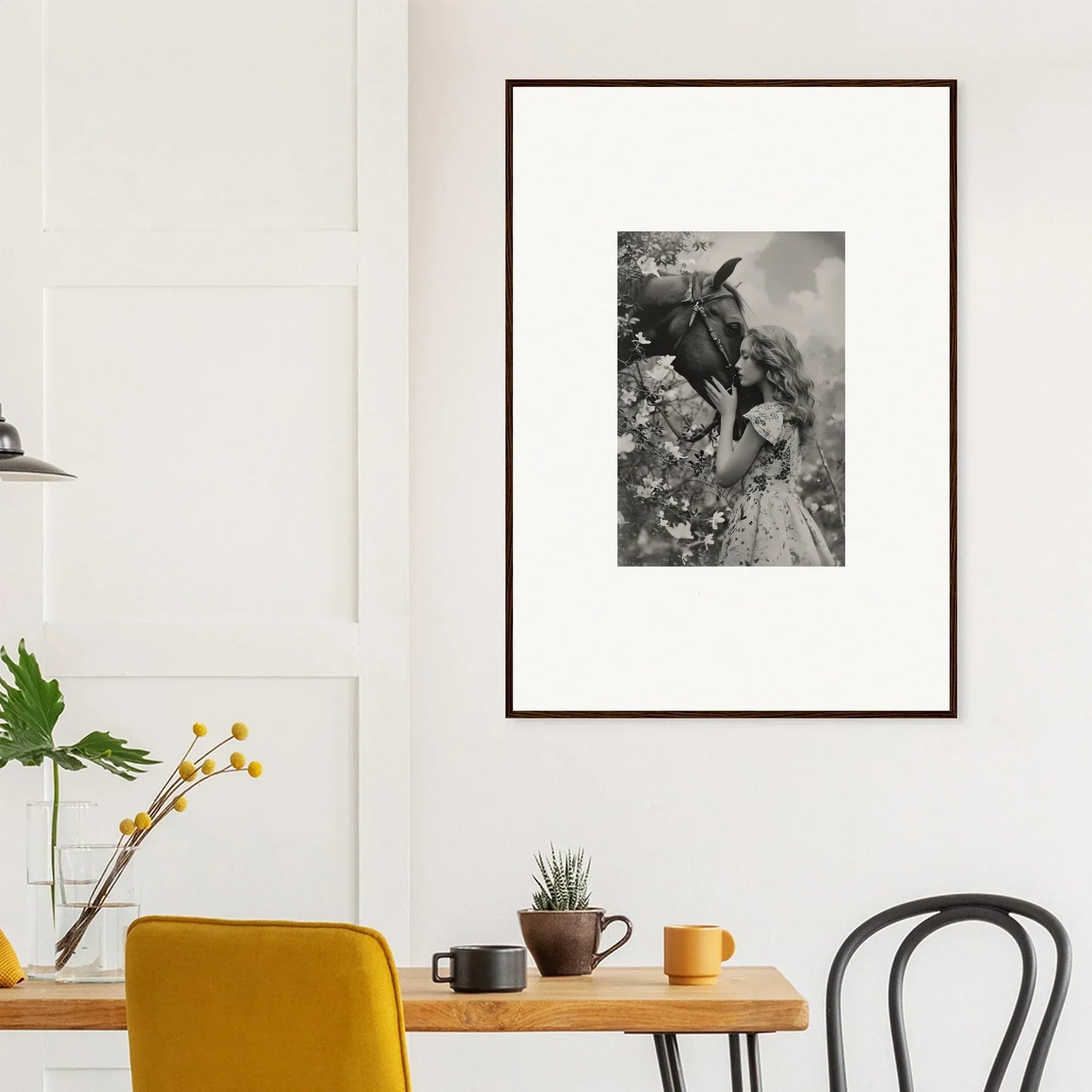 Framed black and white photo of a person and a donkey, perfect for room decoration