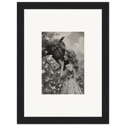 Framed black and white photo of a girl with a flower, perfect for room decoration