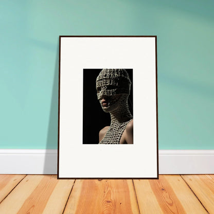 Framed artwork depicting a sculptural bust covered in text or symbols.