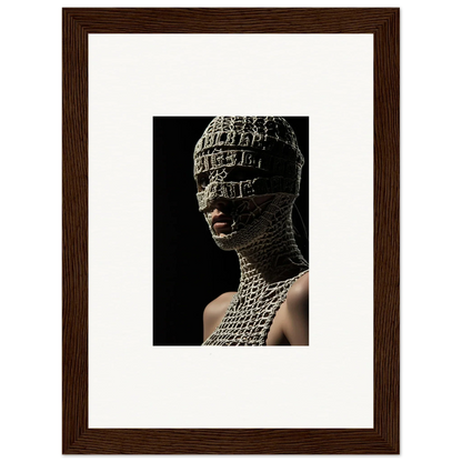 Portrait of a person wearing an intricate, textured head and neck covering resembling chainmail or metalwork.