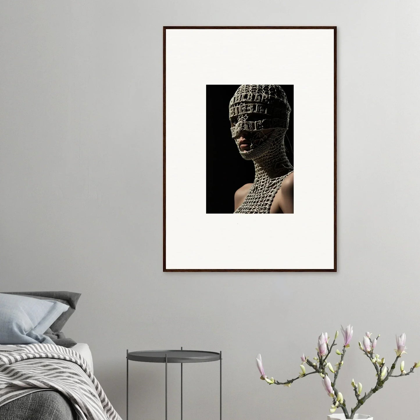 Framed artwork depicting a figure with intricate body paint and headdress against a dark background.