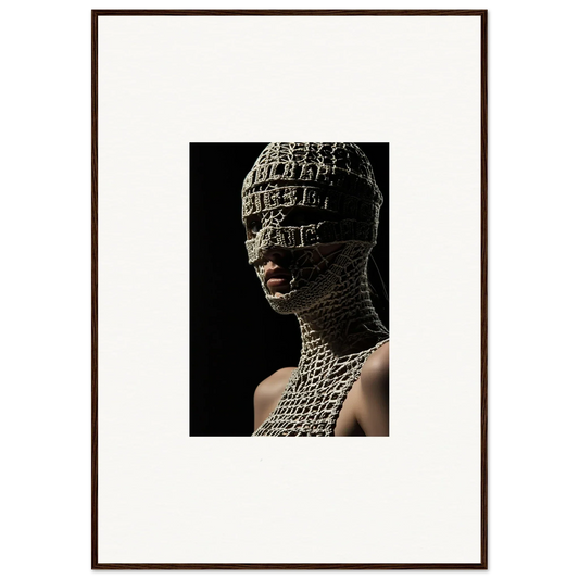 Framed photograph of a person wearing an intricate, textured head and neck covering.