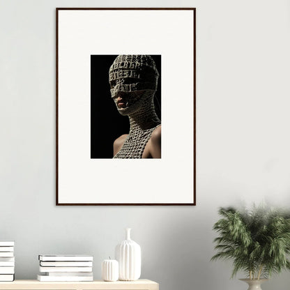 Framed artwork depicting a sculptural bust covered in intricate patterns.