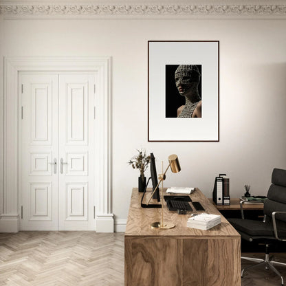 Elegant home office workspace with a wooden desk and framed Buddha artwork.