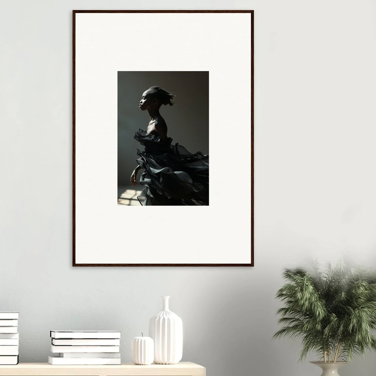 Framed black and white wall art of a silhouetted figure for elegant room decor in Black Alchemy