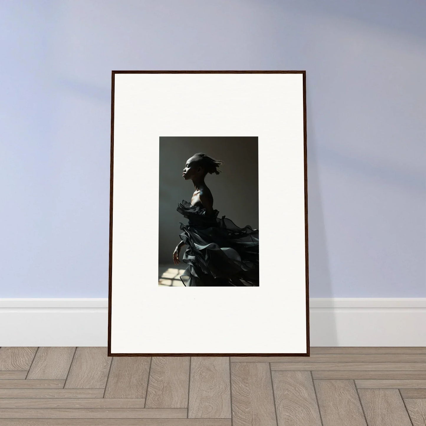 Framed black and white wall art of a person in profile for stylish room decor