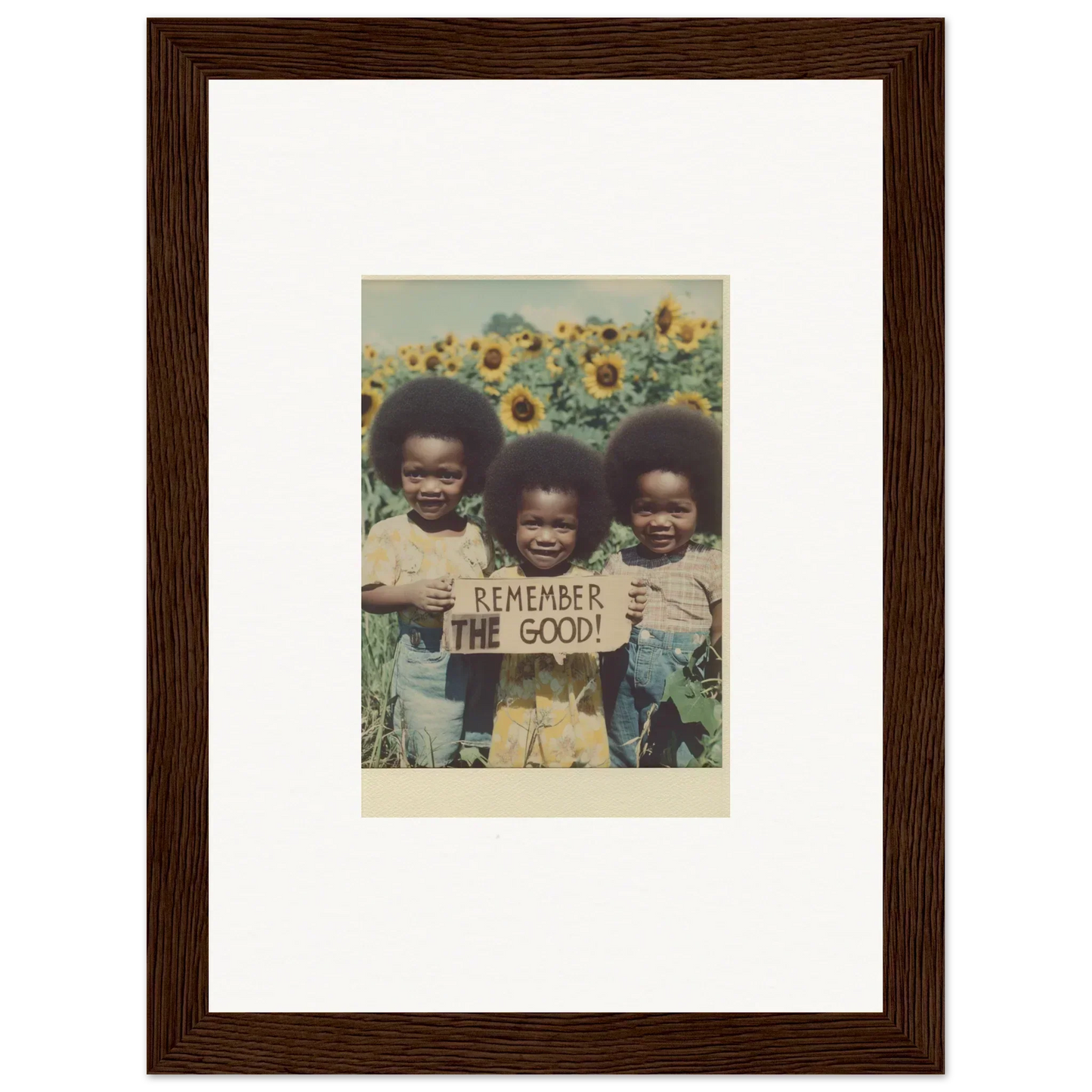 Framed photo of kids with a sign celebrating Bloom Moments for room decoration