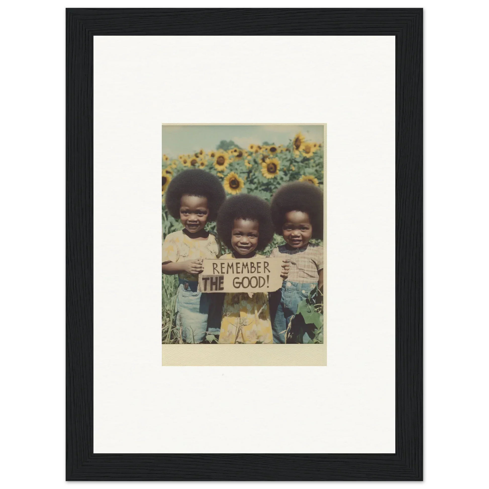 Framed photograph of kids with a sign in a sunflower field for bloom moments decor