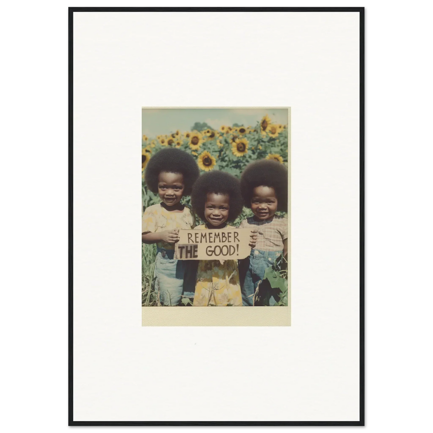 Framed vintage photo of kids with a sign in a sunflower field for bloom moments room decoration