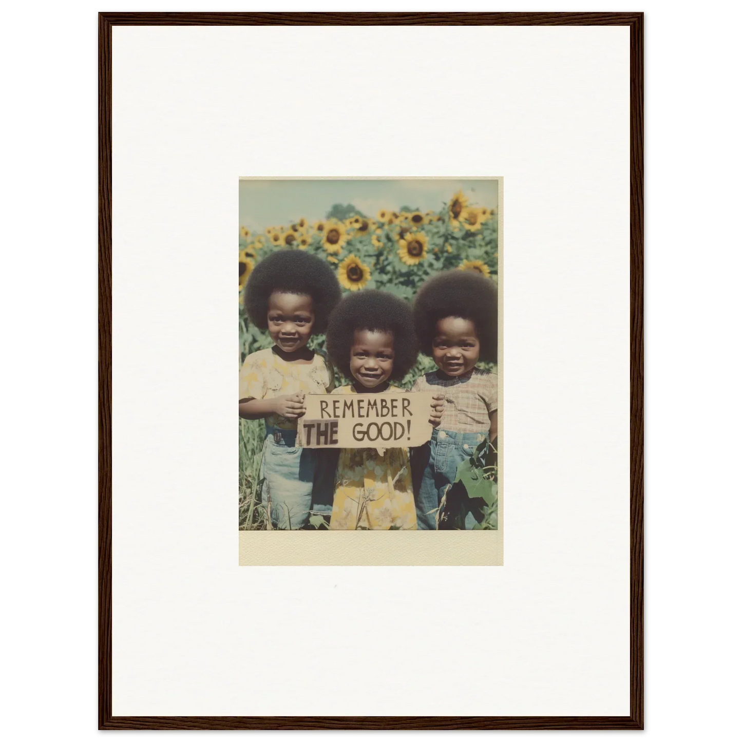 Framed vintage photo of kids in sunflower field with Remember the Good sign for room decoration