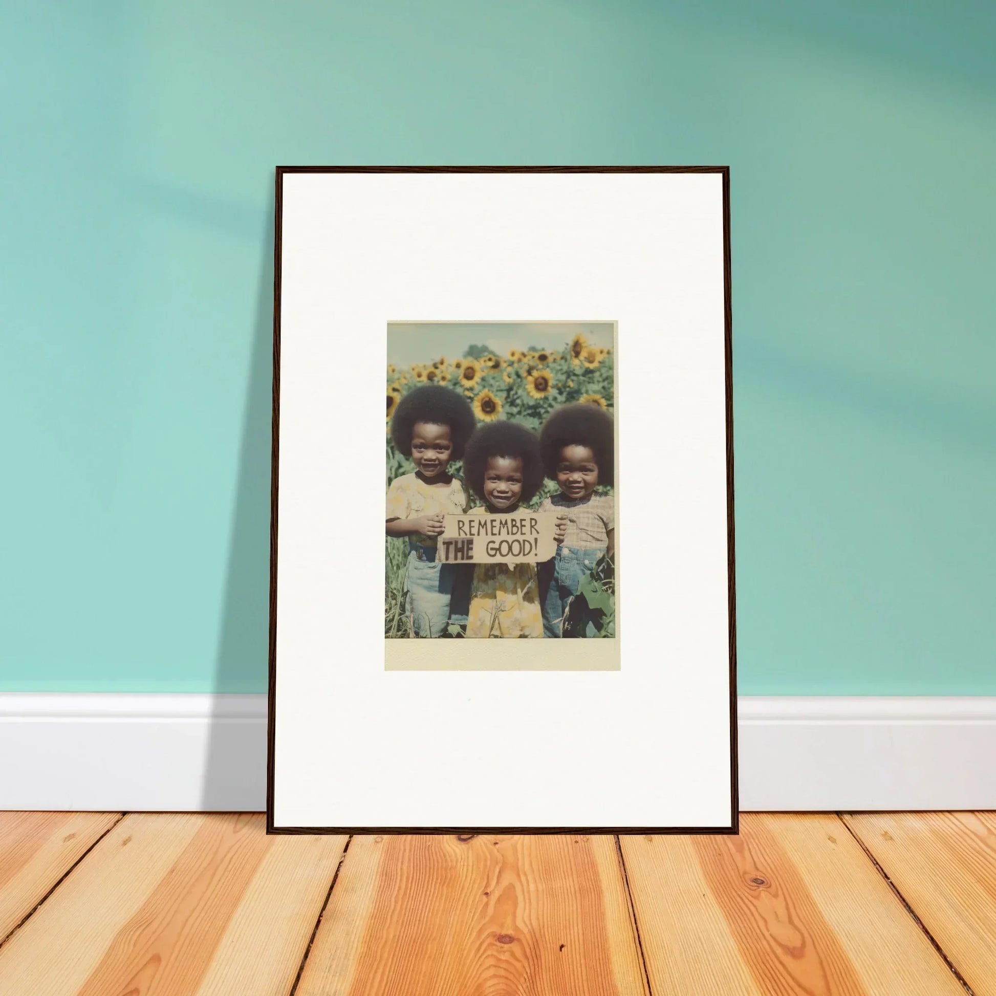 Framed photograph of three kids with a sign in a sunflower field, perfect for bloom moments