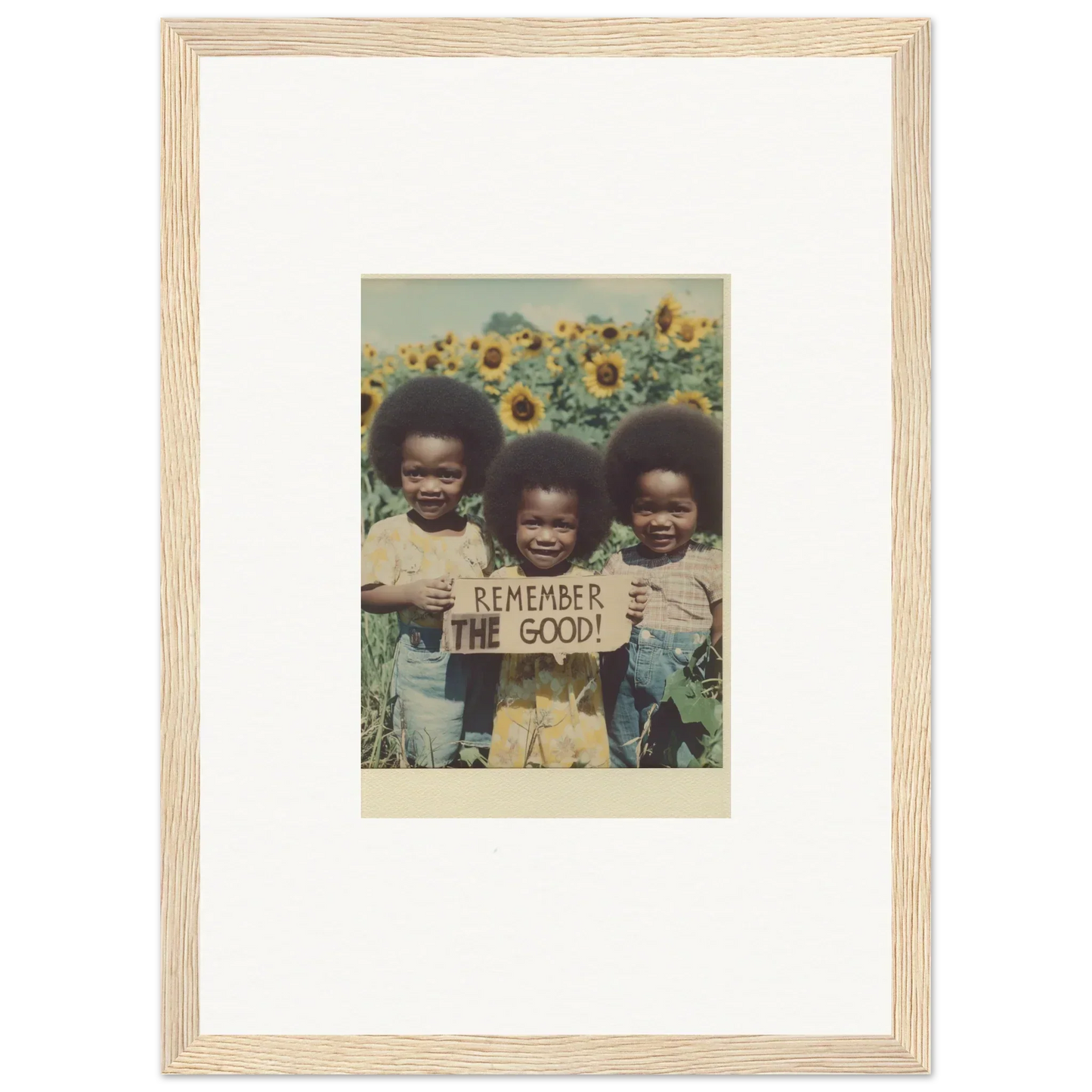 Framed photo of kids with a sign in a sunflower field, perfect for bloom moments room decoration