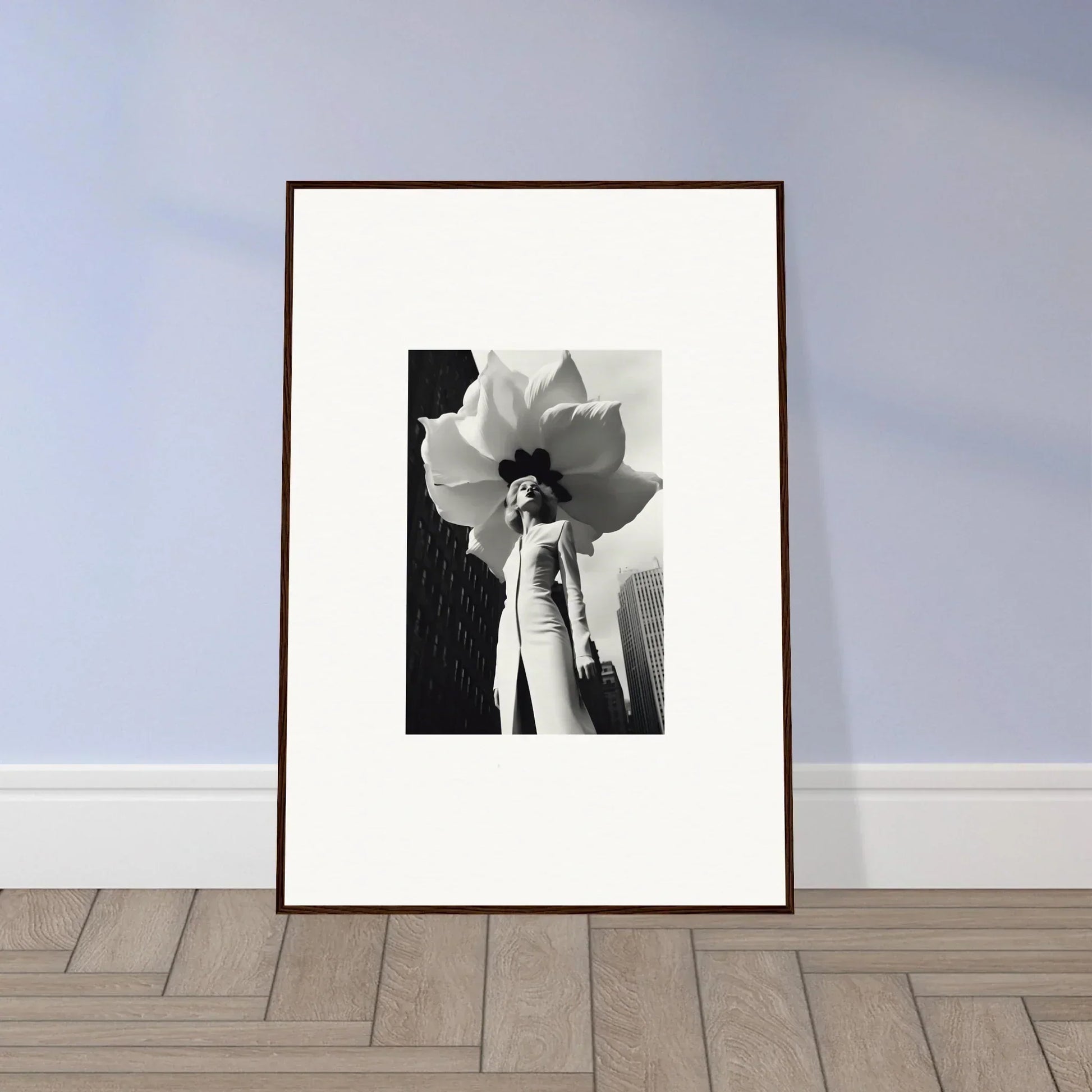 Framed black and white photo of a person with a giant flower, perfect for blossom persona decor