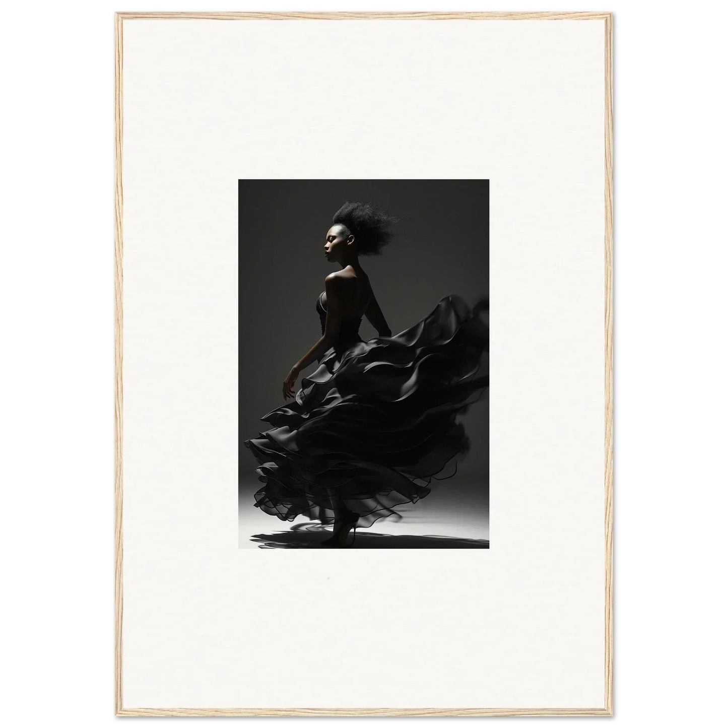 Dancer in a flowing black dress captured mid-twirl against a dark background.