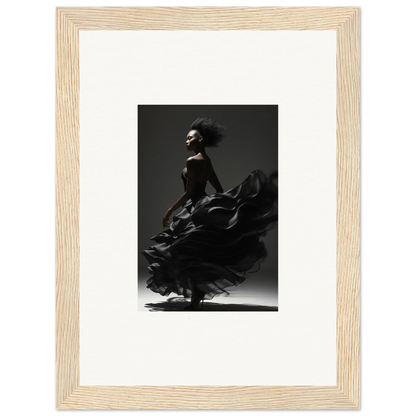 Dramatic black-and-white photograph of a flamenco dancer in motion, framed in light wood.