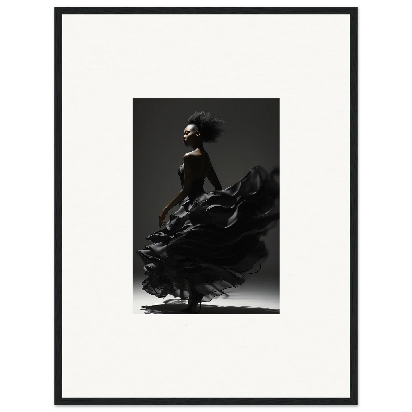 Black and white photograph of a flamenco dancer in motion, her dress swirling dramatically.