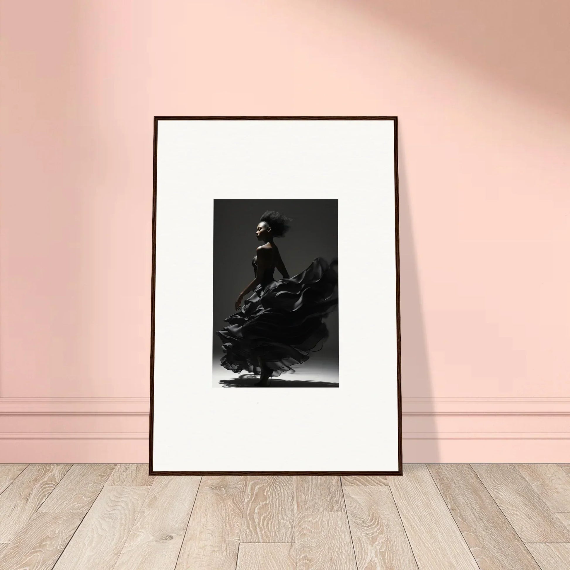 Framed black and white photograph of a dancer in a flowing dress.