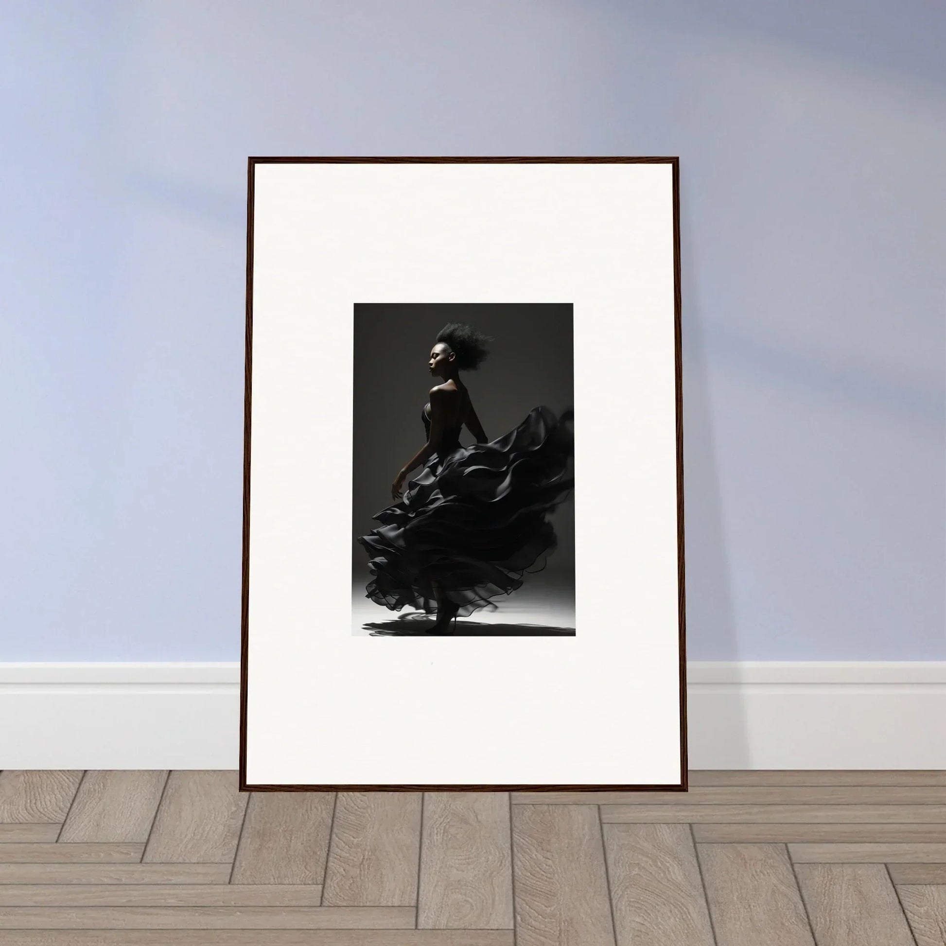 Framed black and white photograph of a dancer in a flowing dress.