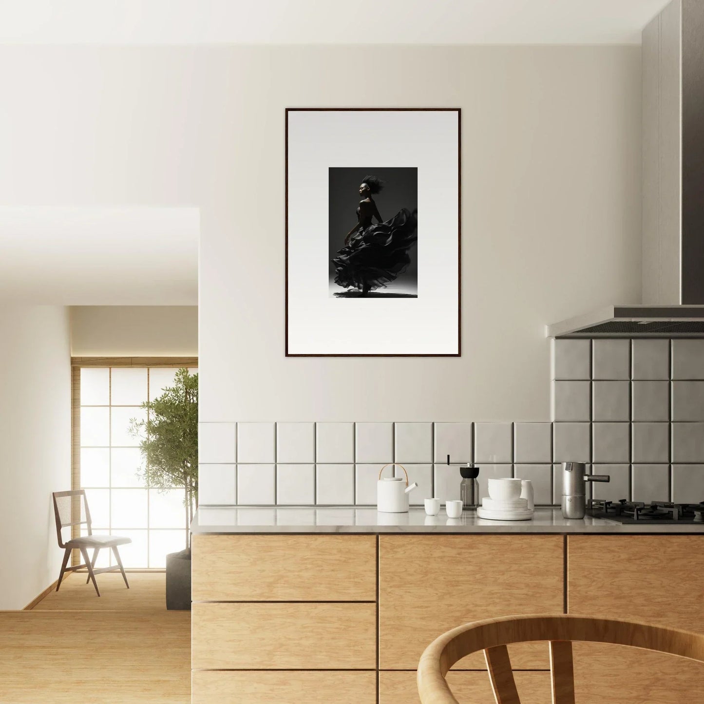 Modern kitchen with wooden cabinets, white tiled backsplash, and framed artwork.