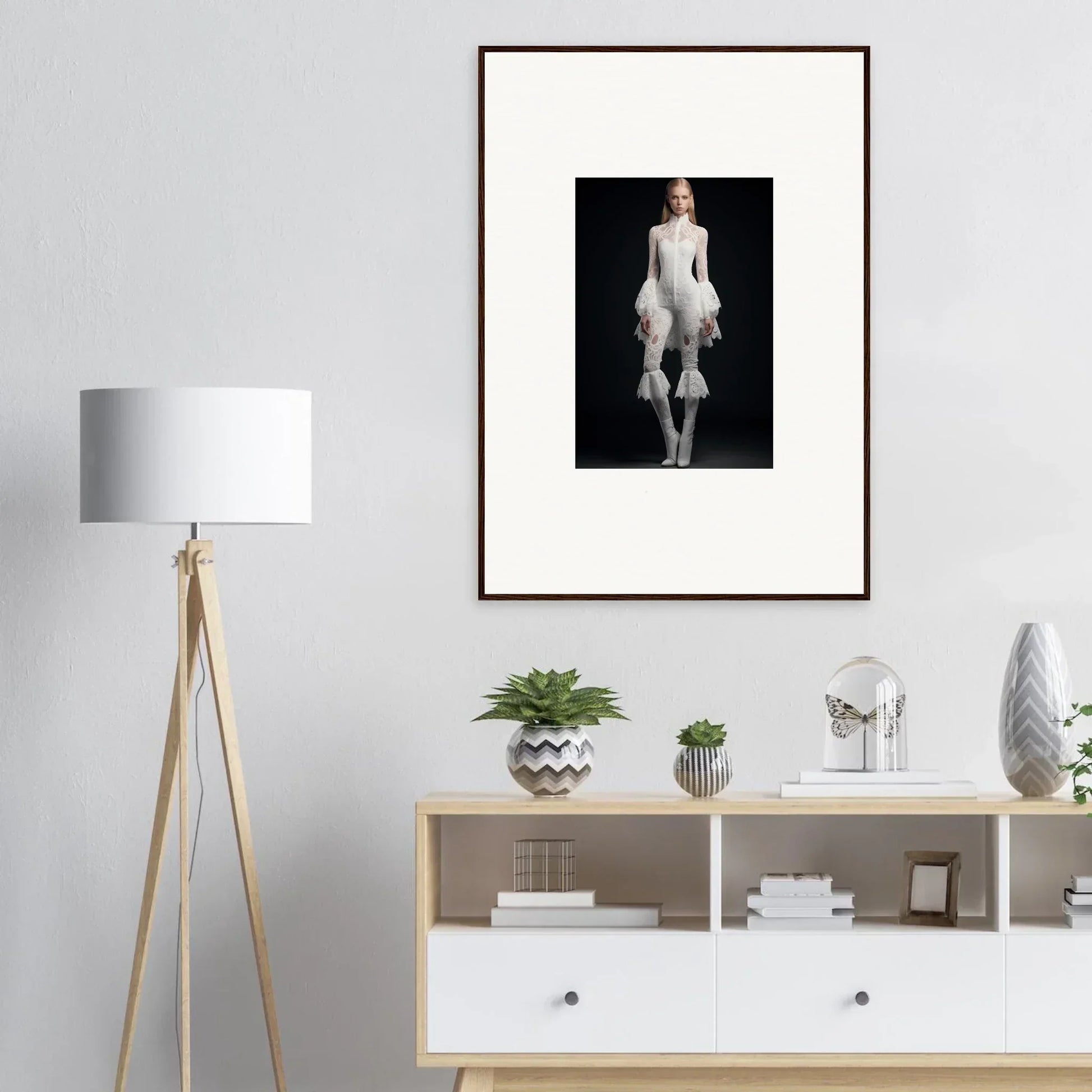 Framed wall art featuring a person in an avant-garde white outfit with voluminous ruffles