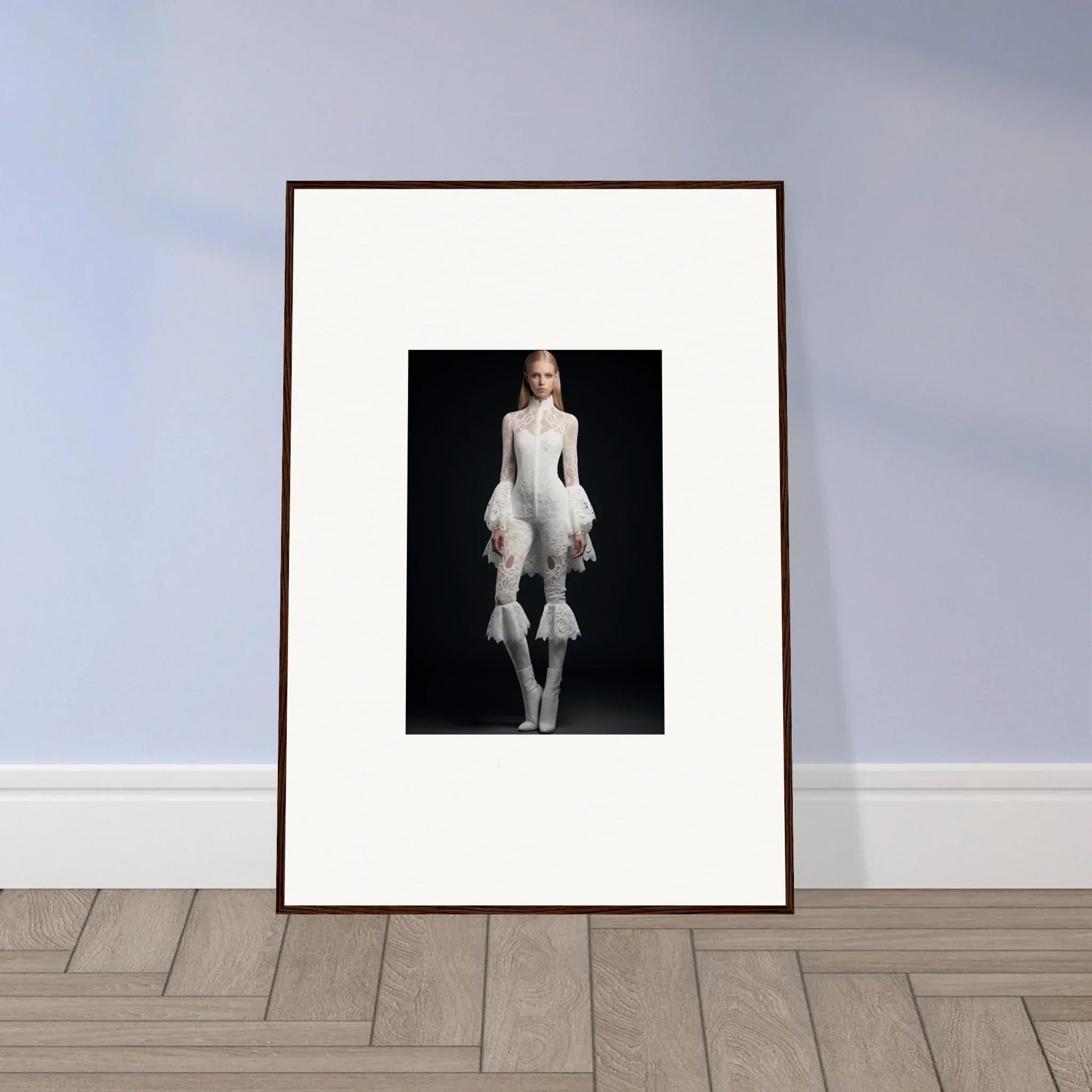 Framed wall art of a person in an avant-garde white ruffled outfit for stylish room decor