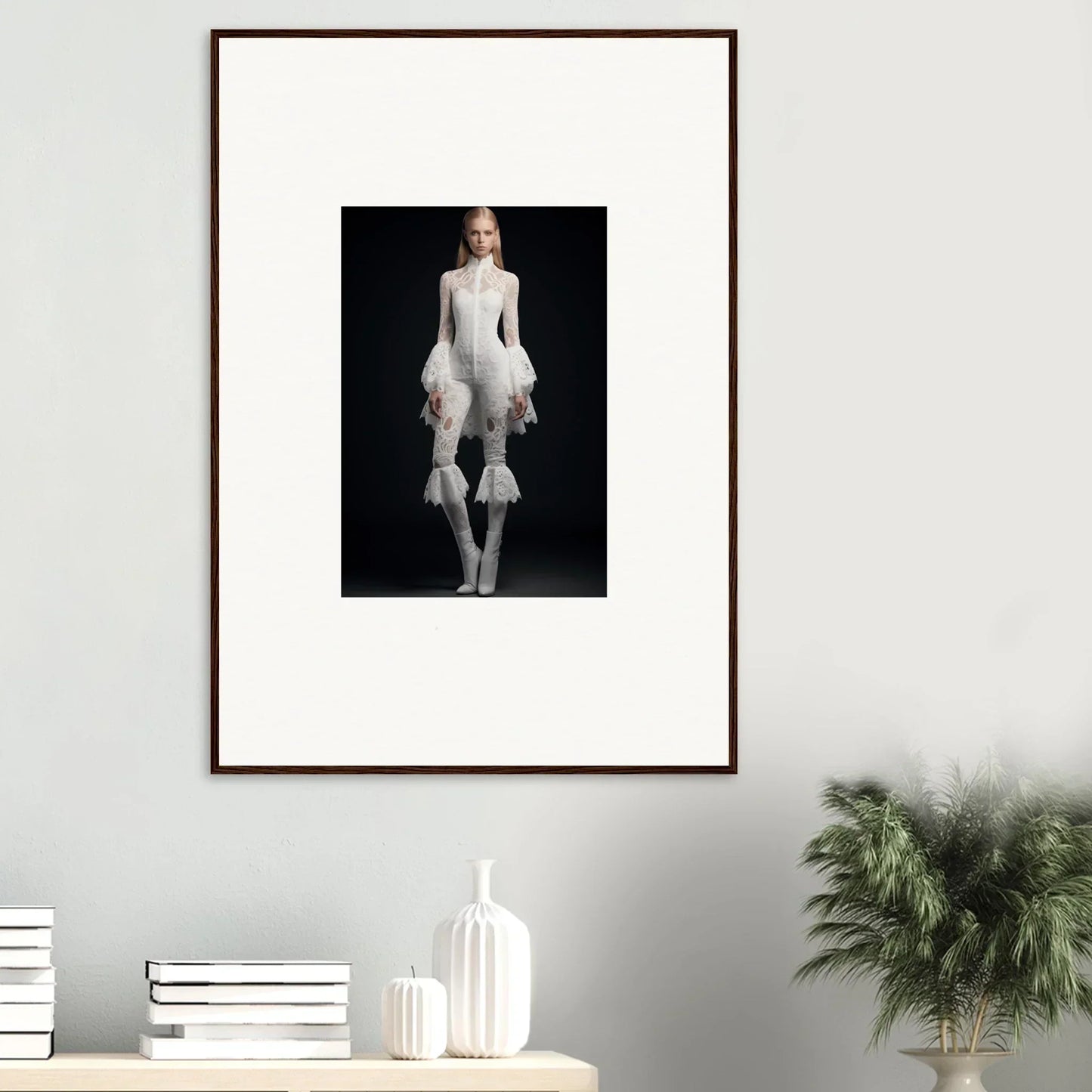 Framed wall art of a person in an all-white outfit on a dark background