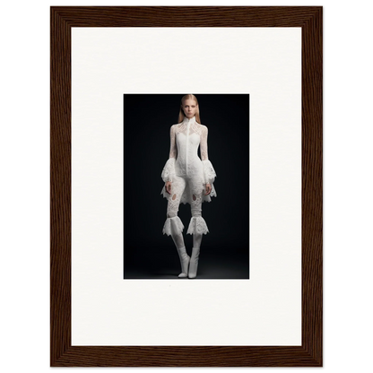 Framed wall art of person in avant-garde white outfit adds unique room decor