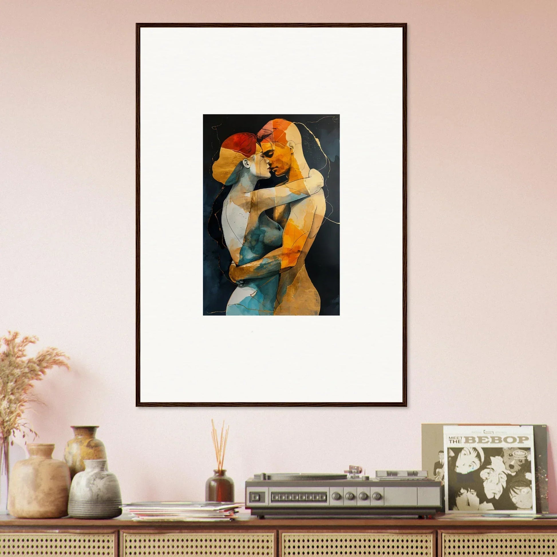 Framed wall art of embracing figures in warm tones, perfect for room decor and embrace waves