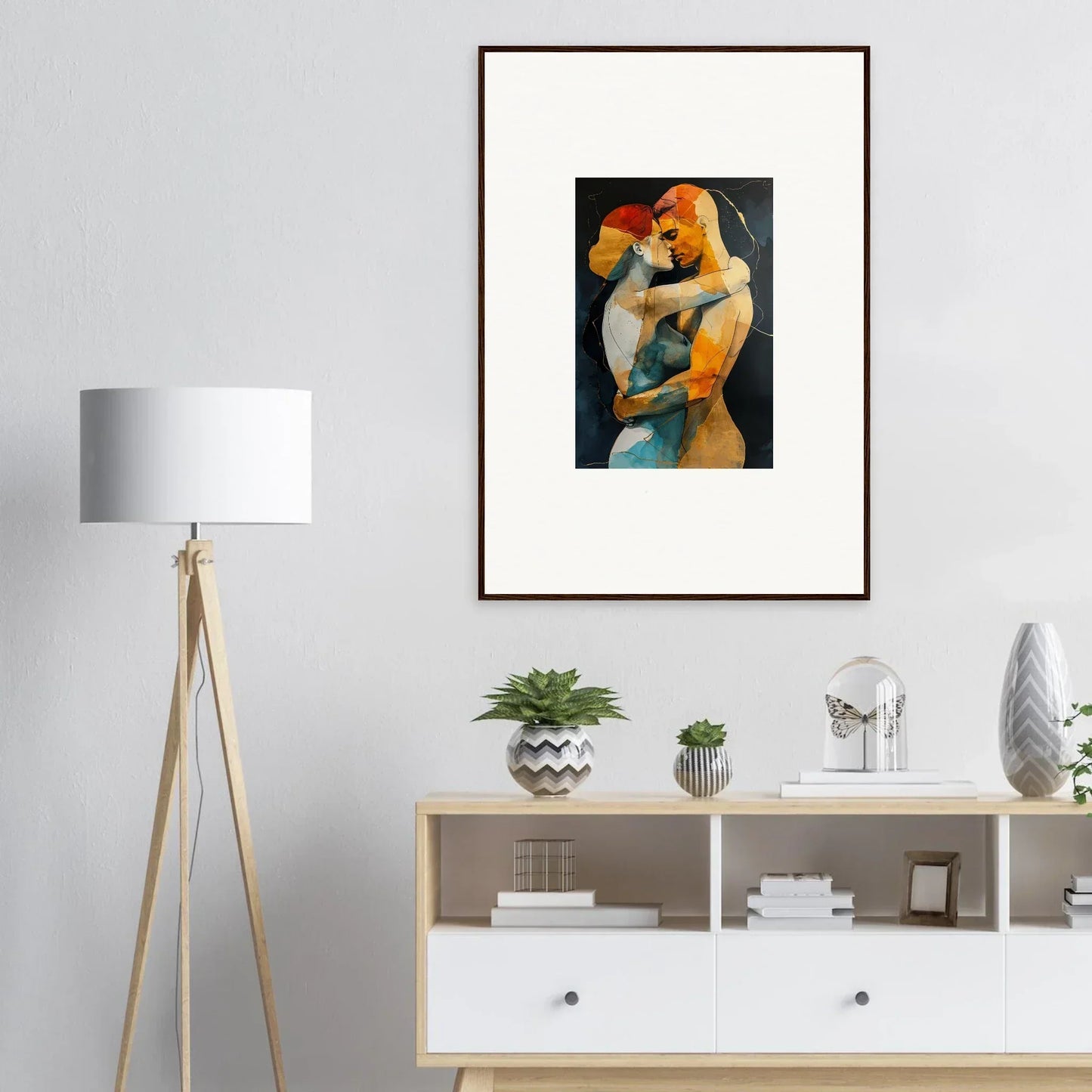 Framed wall art of embracing figures in warm colors for stylish room decor