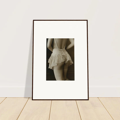 Framed black and white wall art of a person in a ruffled skirt for trendy room decoration