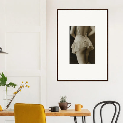 Framed black and white wall art of lower back in a ruffled skirt for room decoration