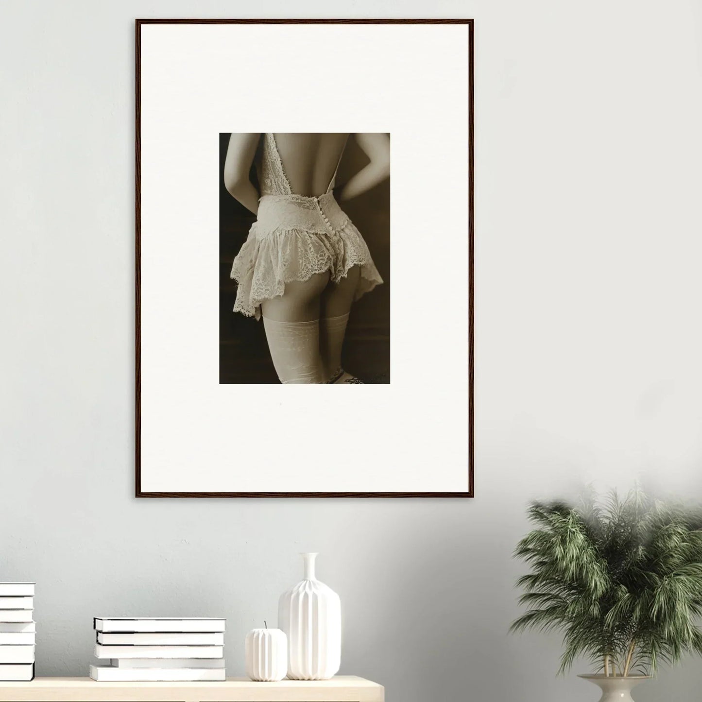 Framed black and white wall art of woman in ruffled skirt for stylish room decoration