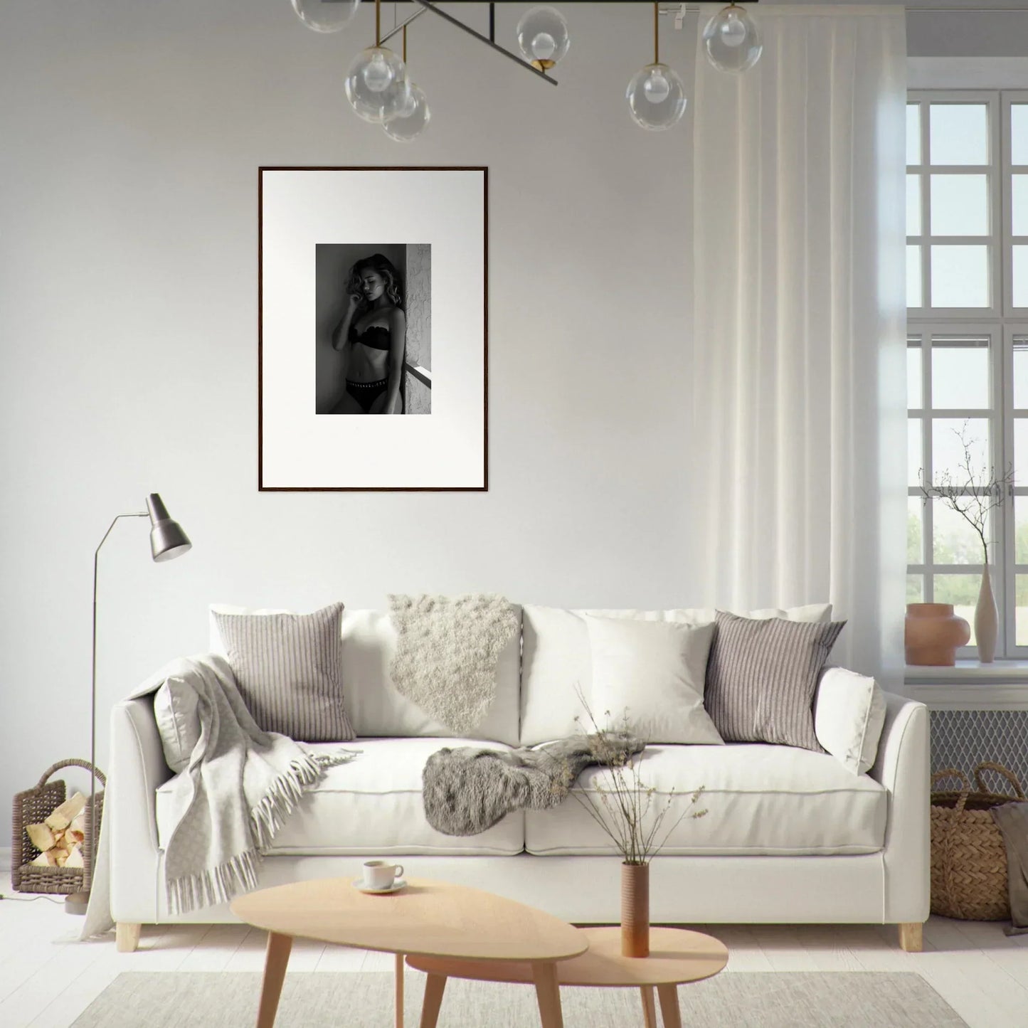 White sofa with throw pillows and blankets.