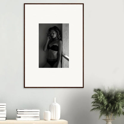 Framed black and white photograph of a woman in lingerie.