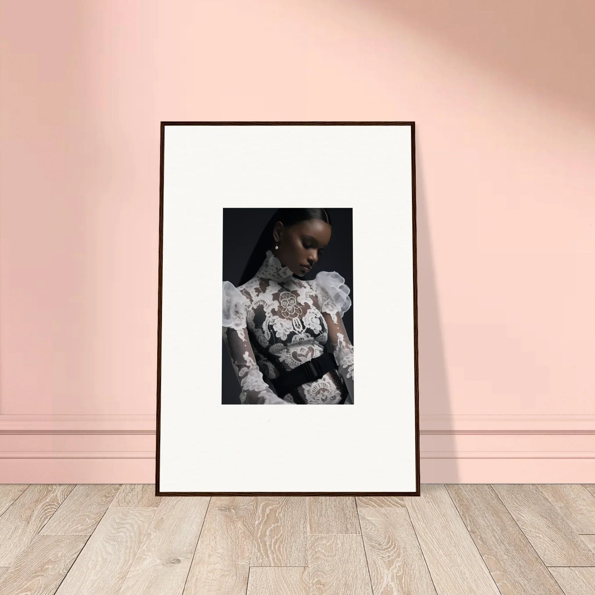 Framed black and white portrait photograph of a person wearing an ornate lace or floral top.