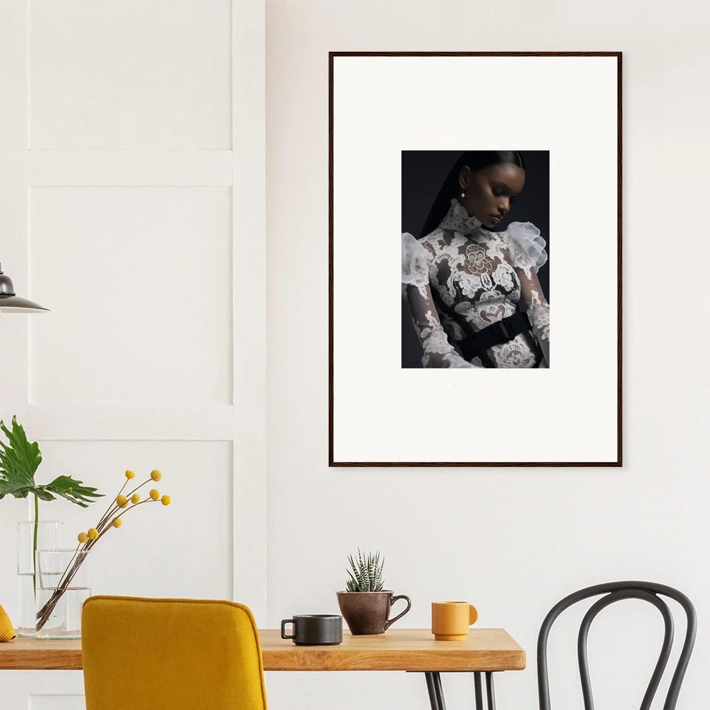 Framed portrait photograph of a person wearing a floral-patterned top against a dark background.