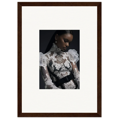 Framed portrait photograph of a woman wearing an ornate white lace top against a dark background.