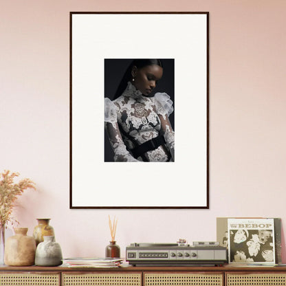 Framed black and white portrait photograph of a person wearing an ornate white lace top.