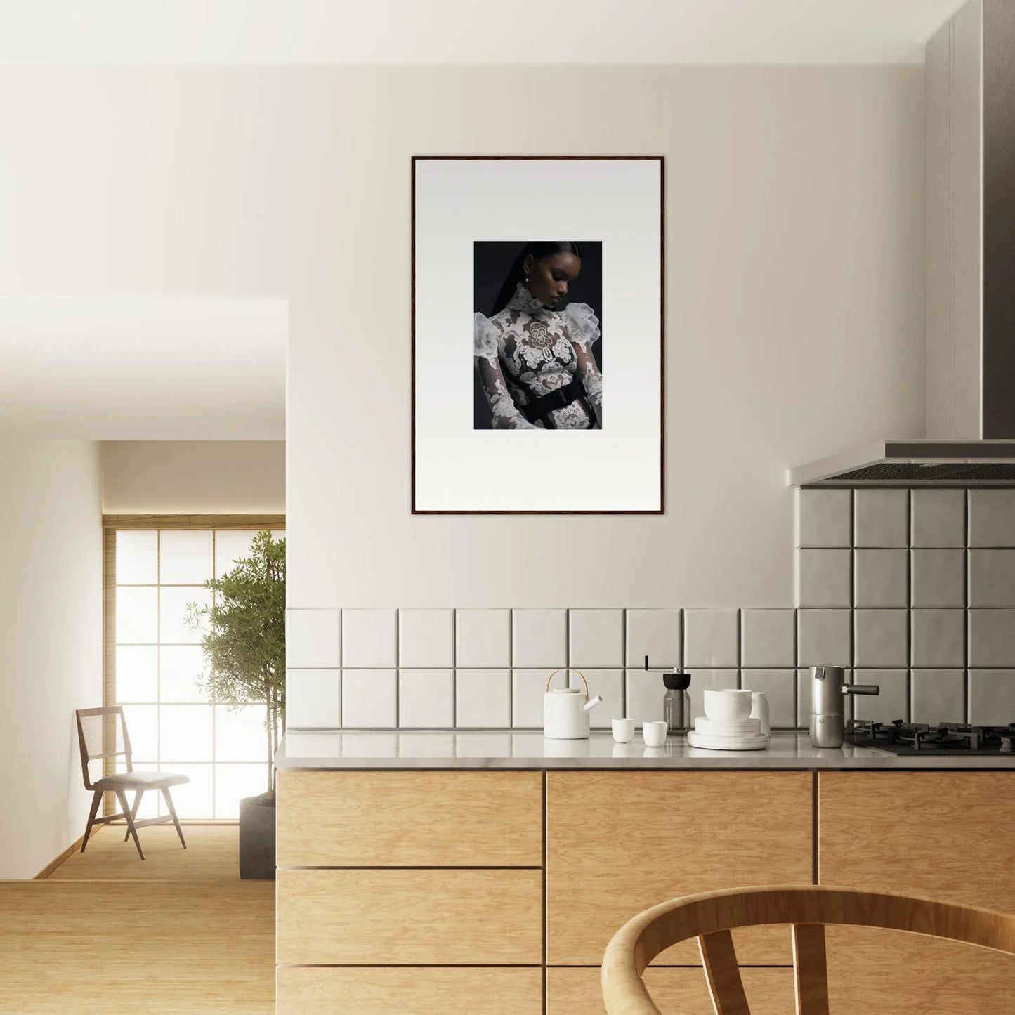 Framed black and white photograph hanging on a kitchen wall.