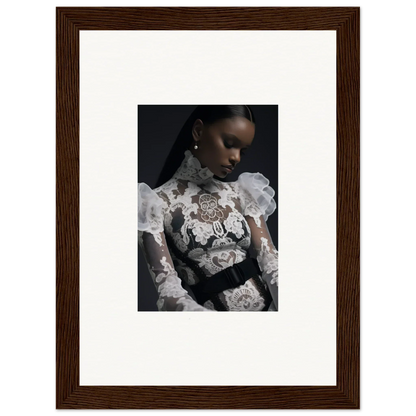 Framed portrait photograph of a woman wearing an ornate white lace top against a dark background.