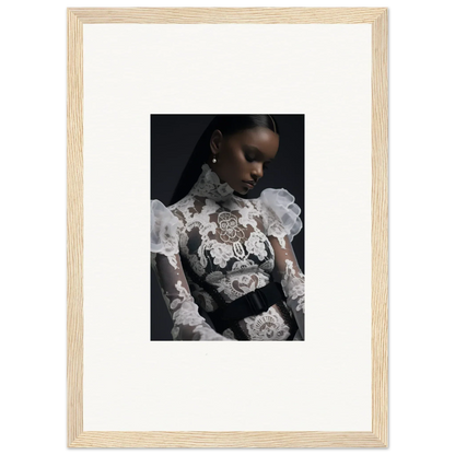 Framed portrait photograph of a woman wearing an ornate white lace top against a dark background.