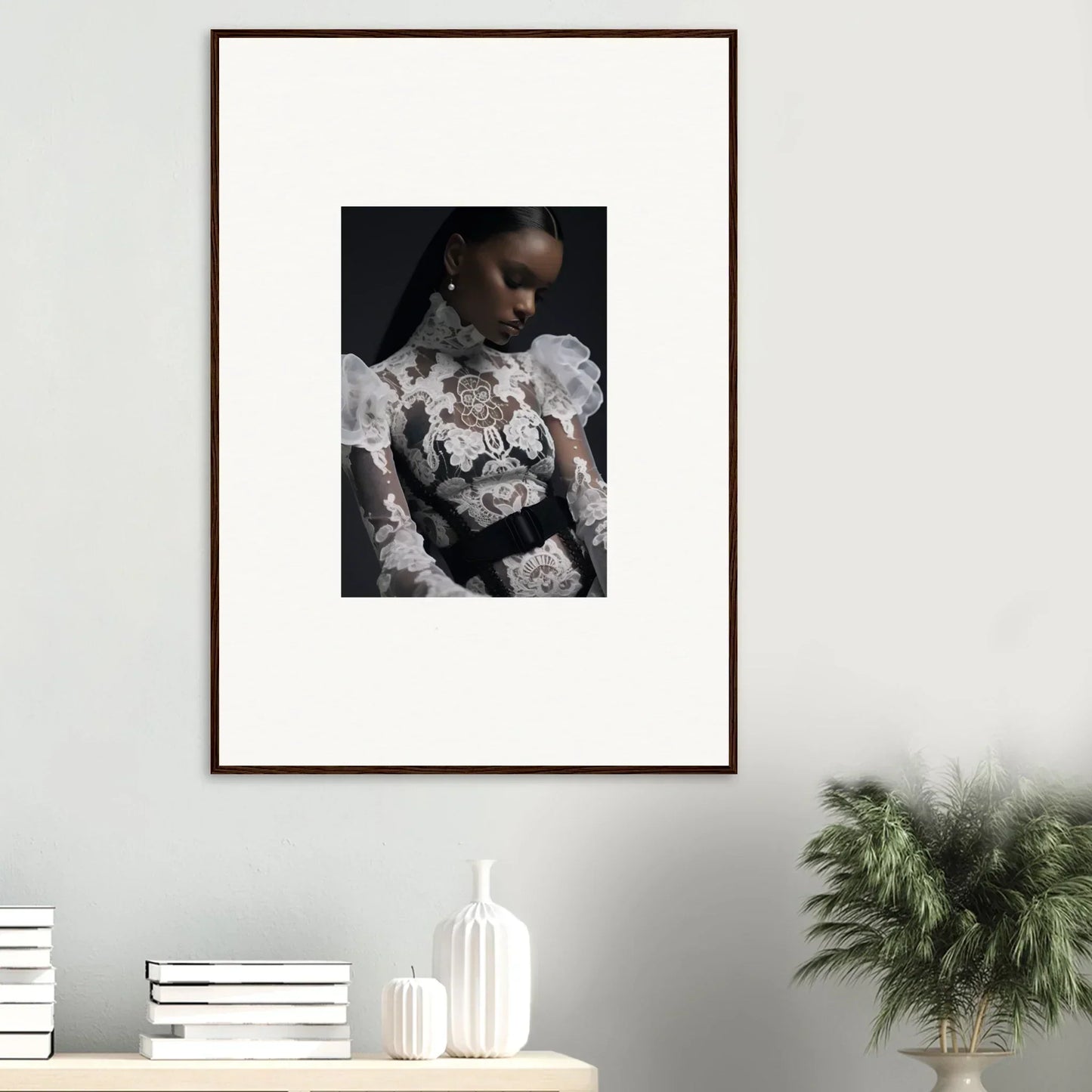 Framed portrait photograph of a person wearing an intricate white lace top against a dark background.